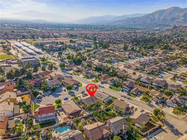 an aerial view of residential building and trees
