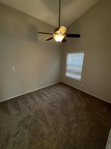 a view of a room with a fan and a fan
