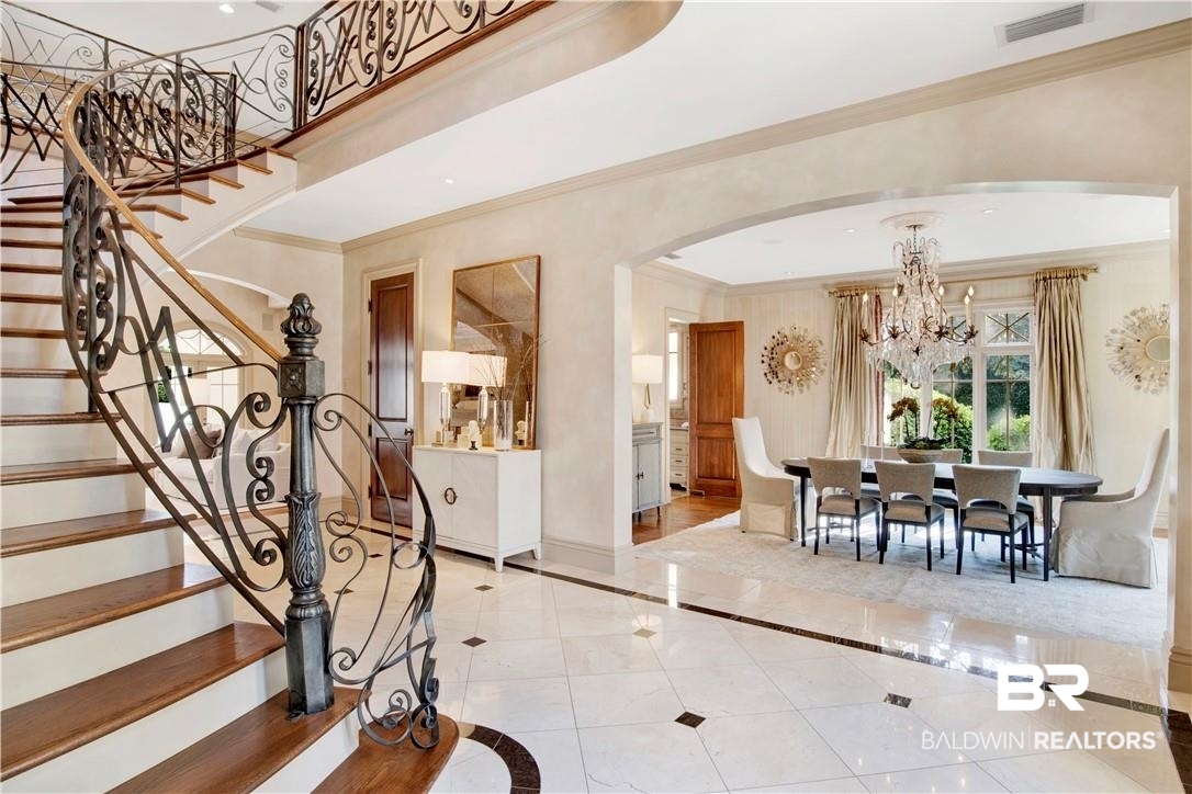 4 Chancery Court Mobile, AL 36608 - Photo 5 of 54 Tiled foyer with ornamental molding and a notable chandelier