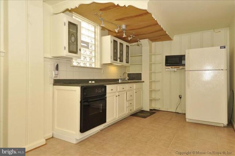 512 Harding Drive Silver Spring, MD 20901 - Photo 11 of 28 a kitchen with a sink and refrigerator
