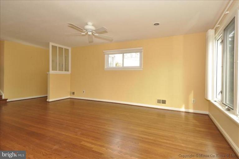 512 Harding Drive Silver Spring, MD 20901 - Photo 14 of 28 an empty room with wooden floor and windows