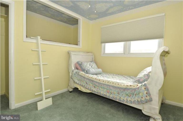 512 Harding Drive Silver Spring, MD 20901 - Photo 17 of 28 a bed sitting in a bedroom next to a window