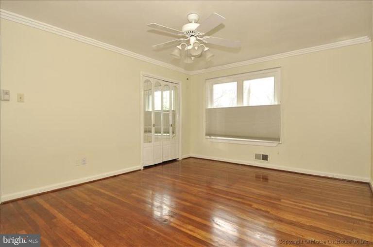 512 Harding Drive Silver Spring, MD 20901 - Photo 20 of 28 wooden floor in an empty room with a window