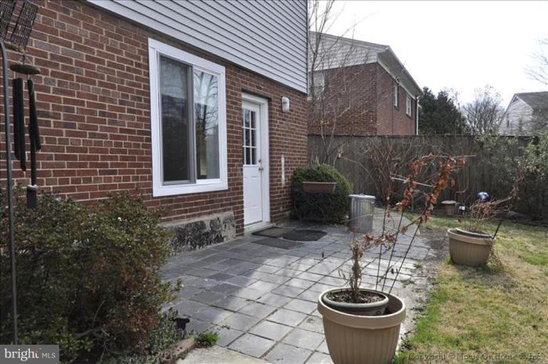 512 Harding Drive Silver Spring, MD 20901 - Photo 3 of 28 a view of a backyard with plants and a patio