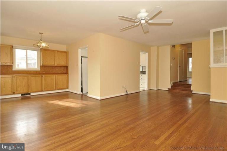 512 Harding Drive Silver Spring, MD 20901 - Photo 21 of 28 a view of an empty room with window and wooden floor