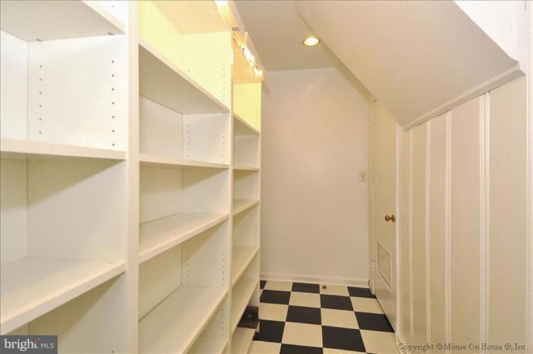 512 Harding Drive Silver Spring, MD 20901 - Photo 26 of 28 a room with a black white checkered floor and a large window