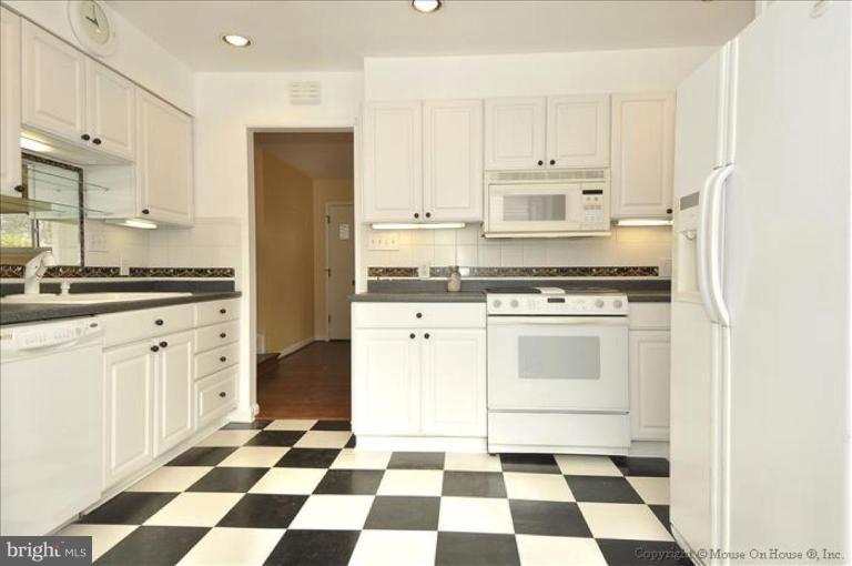 512 Harding Drive Silver Spring, MD 20901 - Photo 28 of 28 a kitchen with a stove a sink and a refrigerator