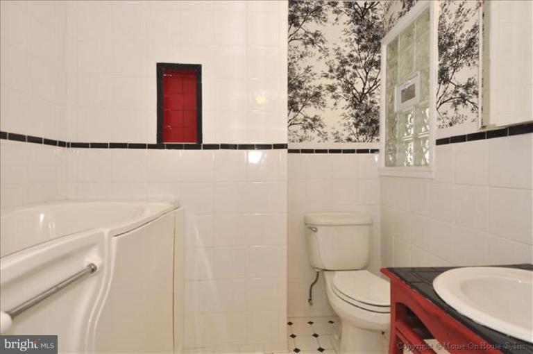 512 Harding Drive Silver Spring, MD 20901 - Photo 4 of 28 a bathroom with a toilet and a sink