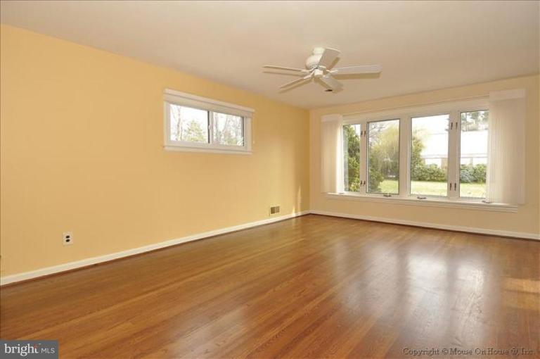 512 Harding Drive Silver Spring, MD 20901 - Photo 8 of 28 a view of an empty room with wooden floor and a window