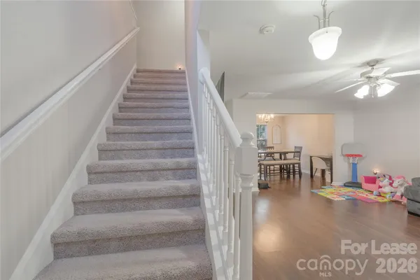 a view of entryway and hall with wooden floor