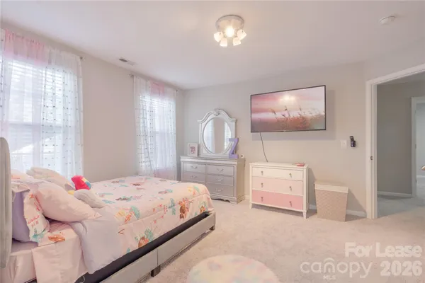 a bedroom with a bed and furniture