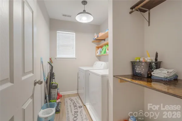 a dining room with furniture and a window