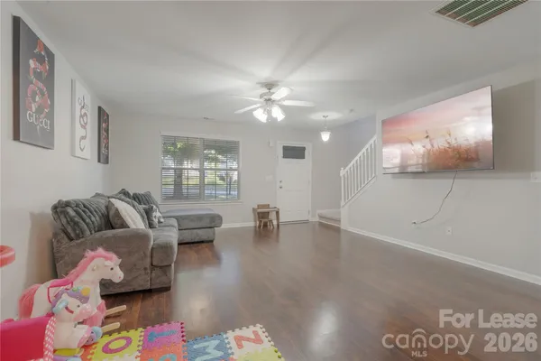 a living room with furniture and window