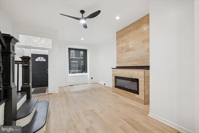 wooden floor fireplace and windows in a room