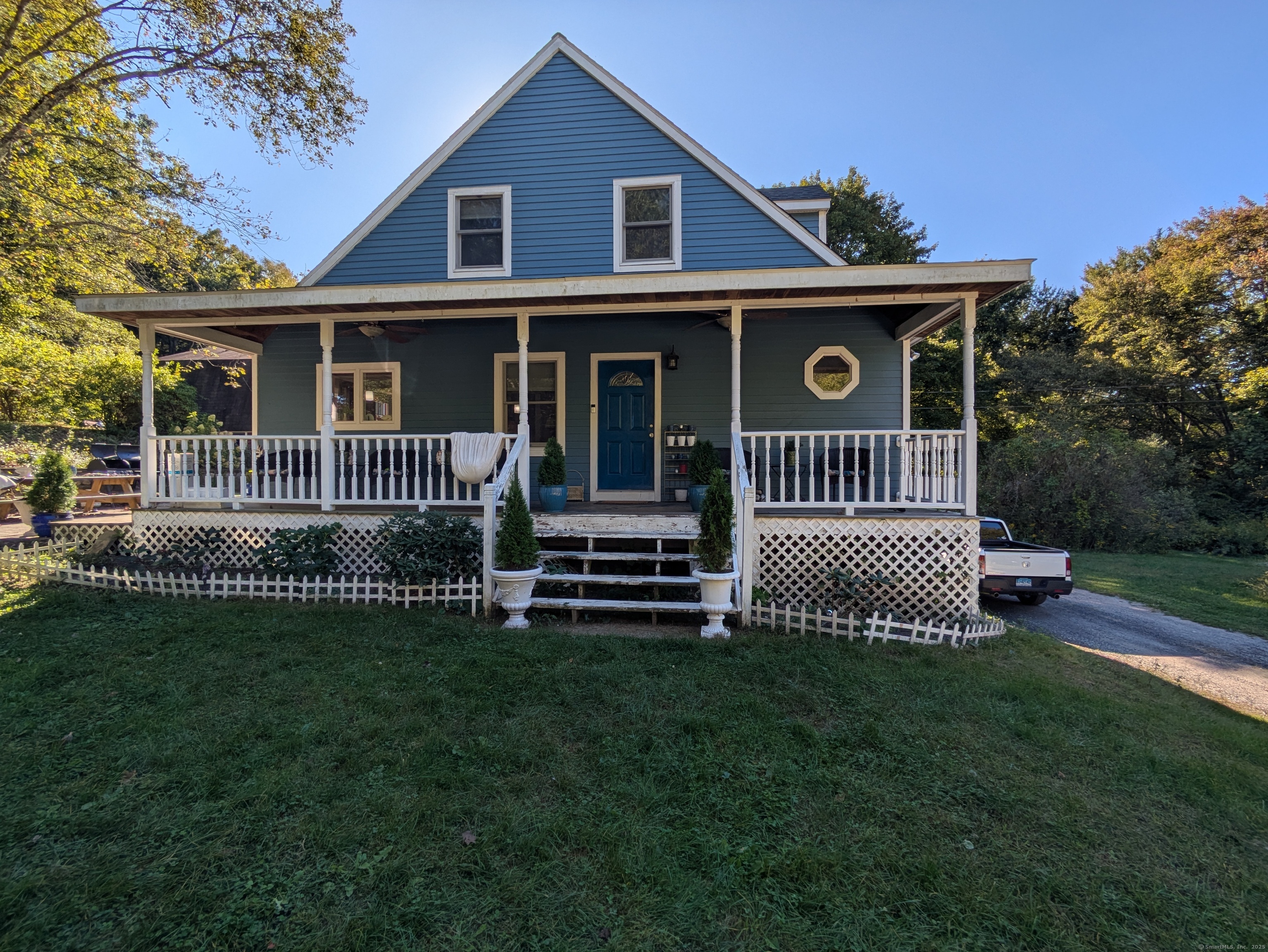 541 Benson Road Middlebury, CT 06762 - Photo 1 of 24 a front view of a house with a garden