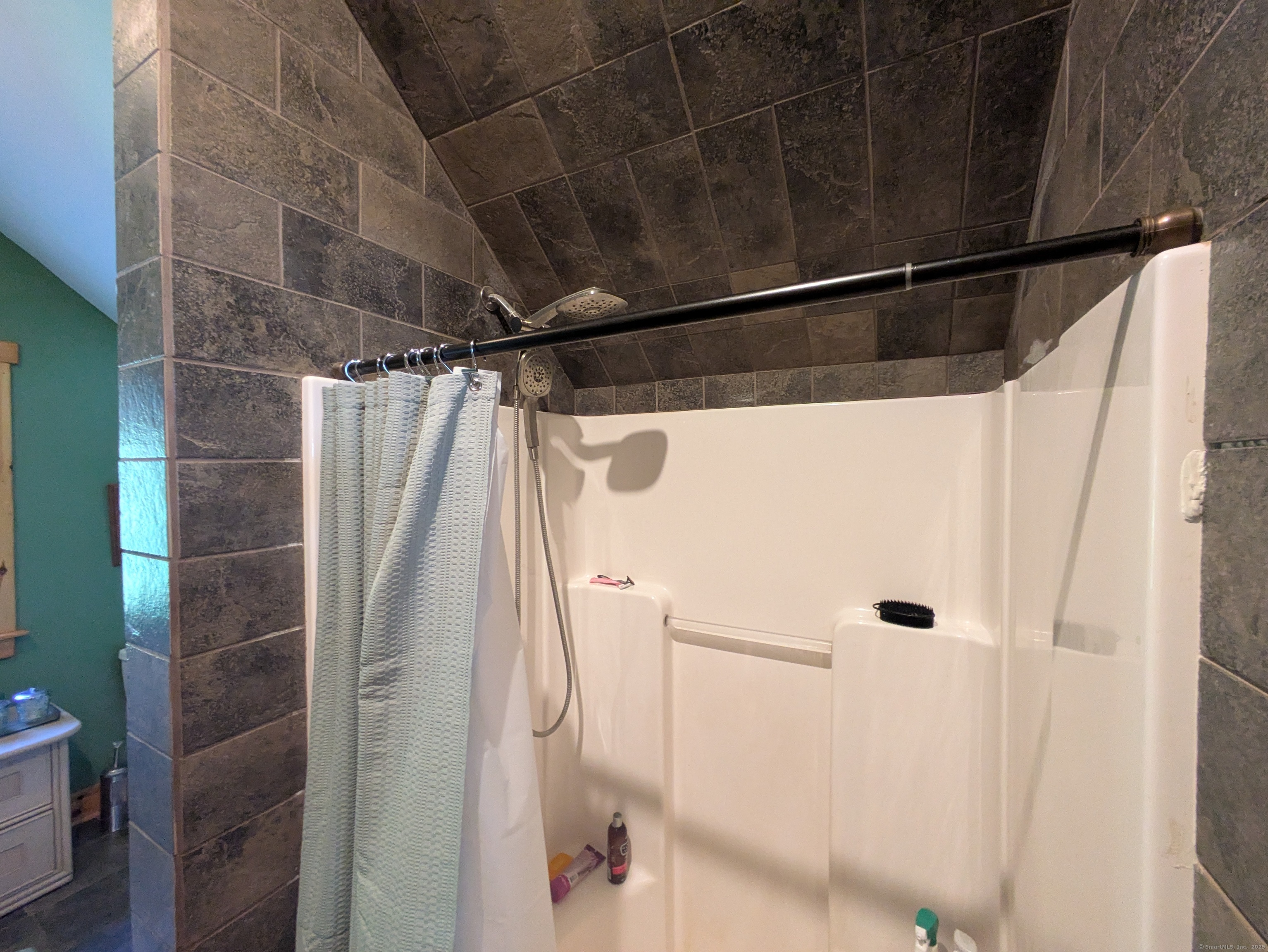 541 Benson Road Middlebury, CT 06762 - Photo 19 of 24 a bathroom with a shower and a glass door