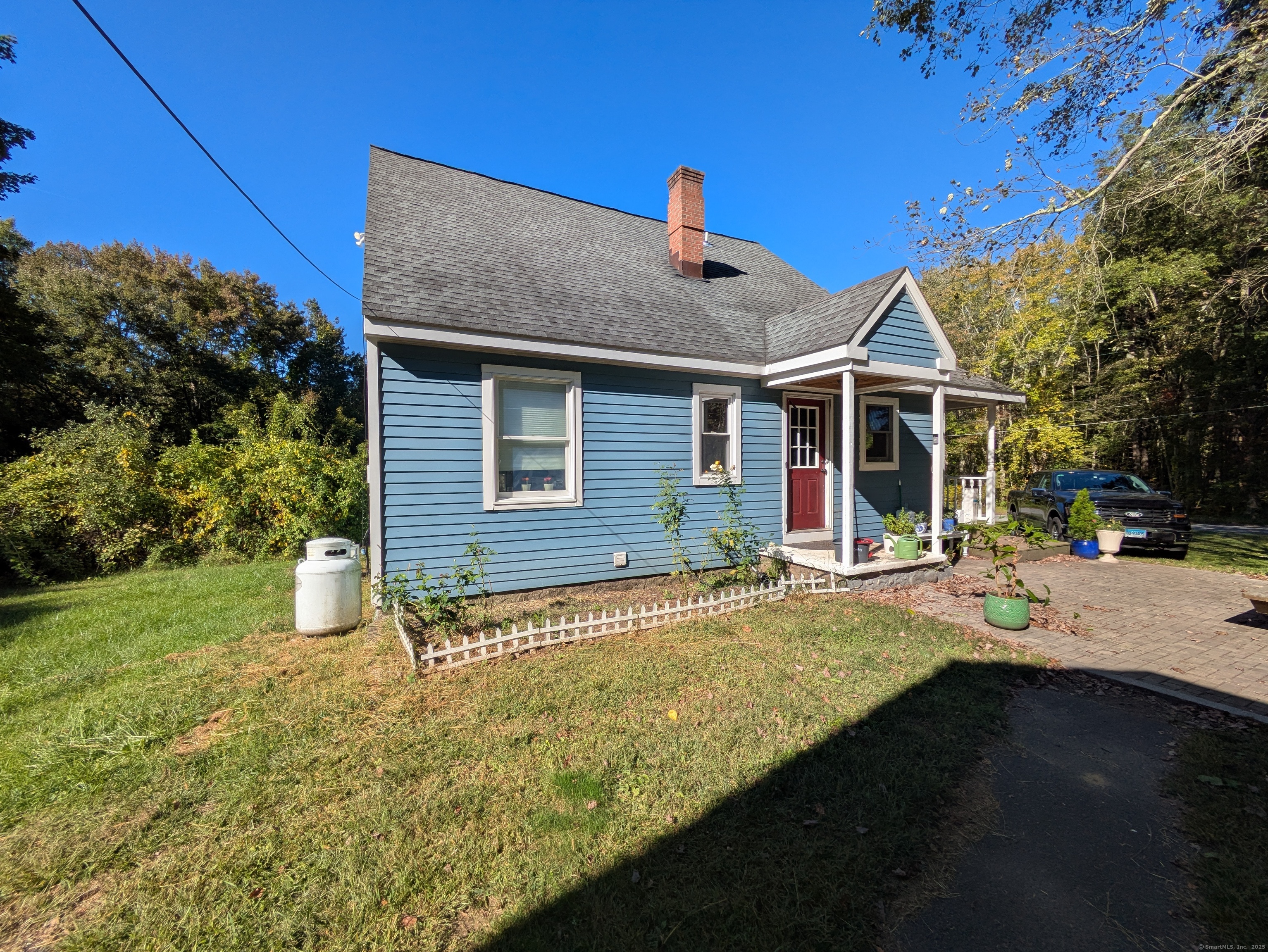 541 Benson Road Middlebury, CT 06762 - Photo 2 of 24 a front view of a house with a yard