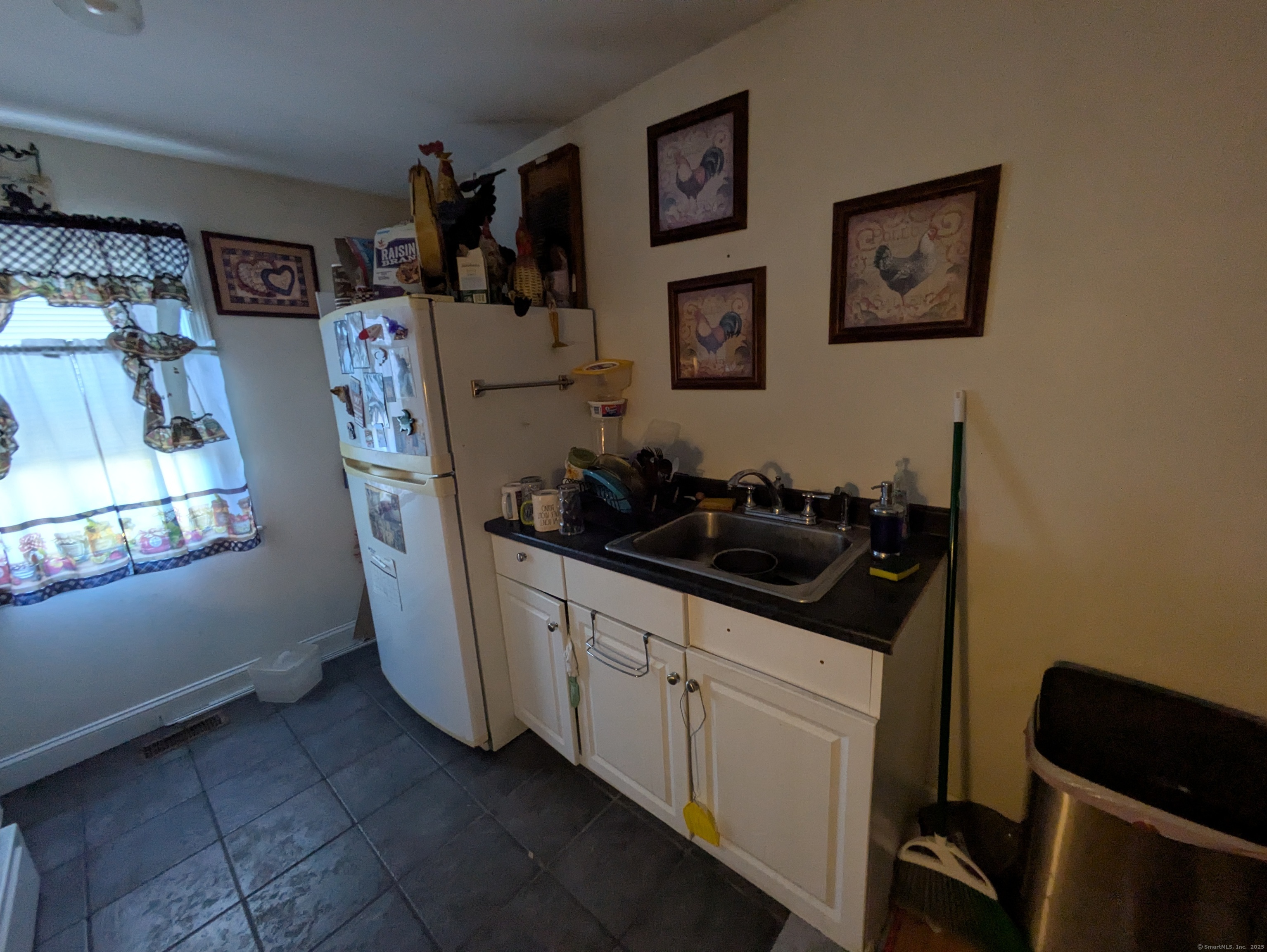 541 Benson Road Middlebury, CT 06762 - Photo 23 of 24 a kitchen with stainless steel appliances a sink a refrigerator and a stove top oven