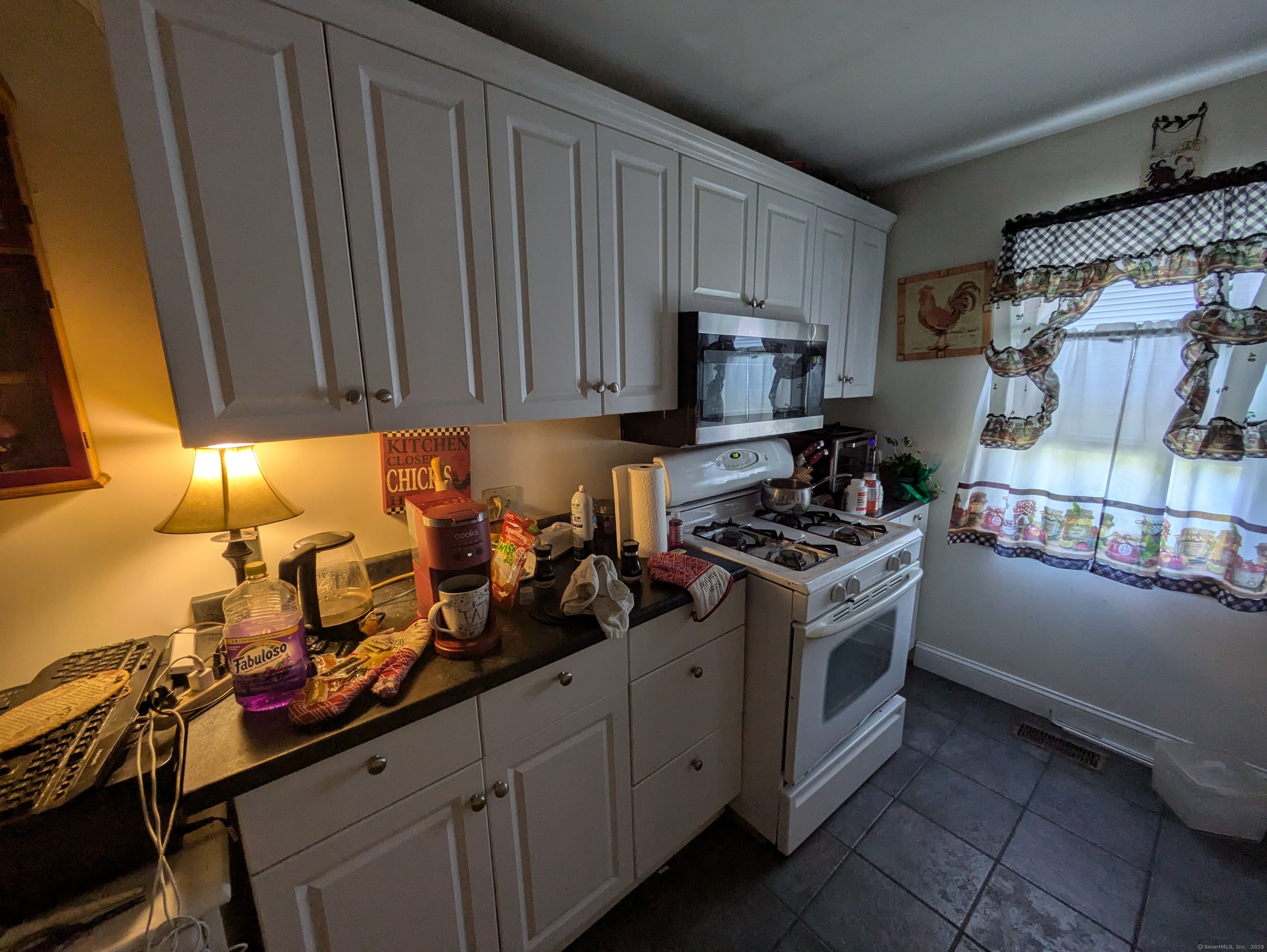 541 Benson Road Middlebury, CT 06762 - Photo 24 of 24 a kitchen with a stove and a refrigerator