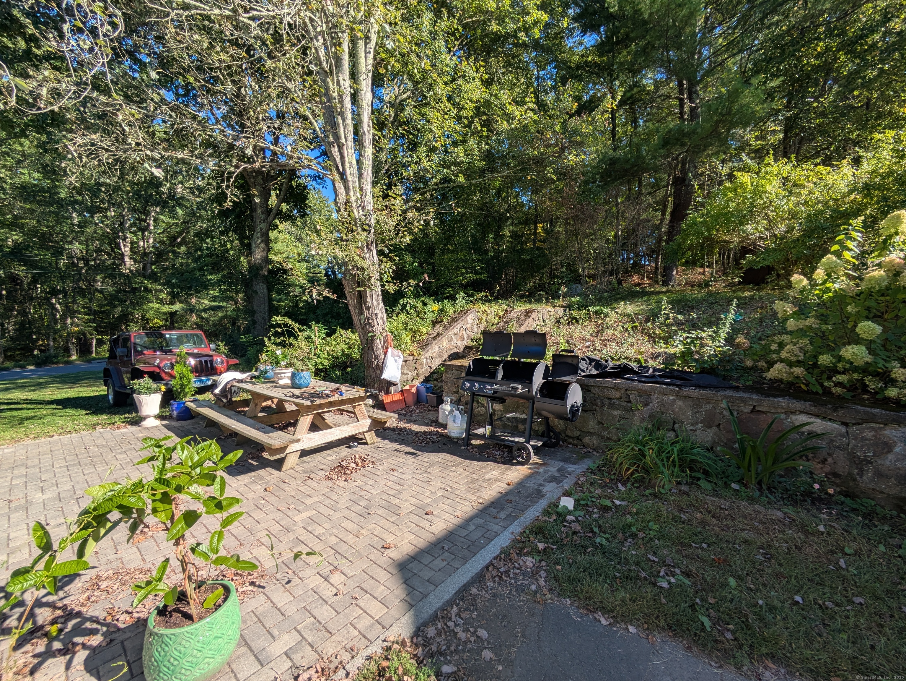541 Benson Road Middlebury, CT 06762 - Photo 5 of 24 a view of a backyard with sitting area