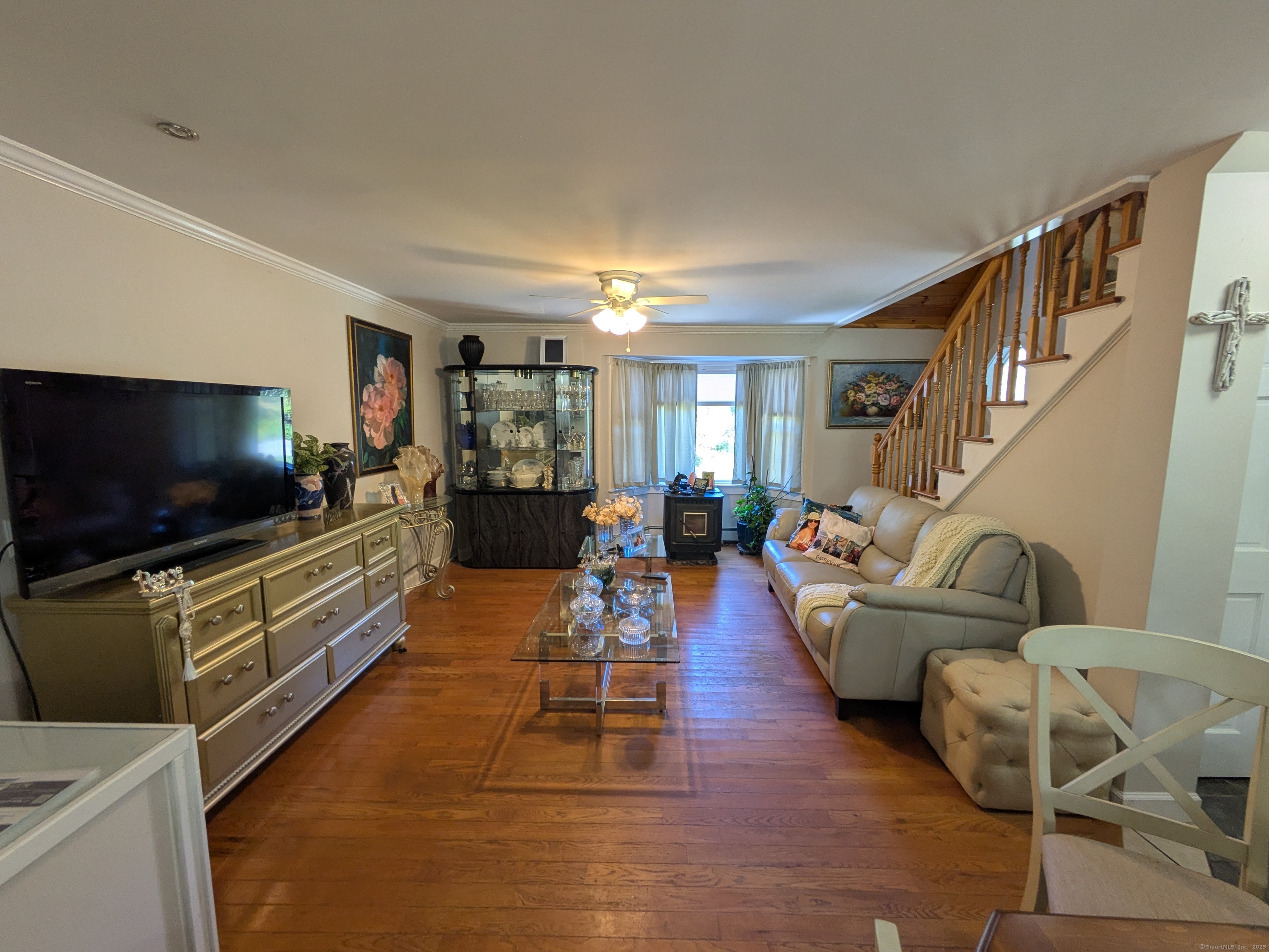 541 Benson Road Middlebury, CT 06762 - Photo 7 of 24 a living room with furniture and a flat screen tv