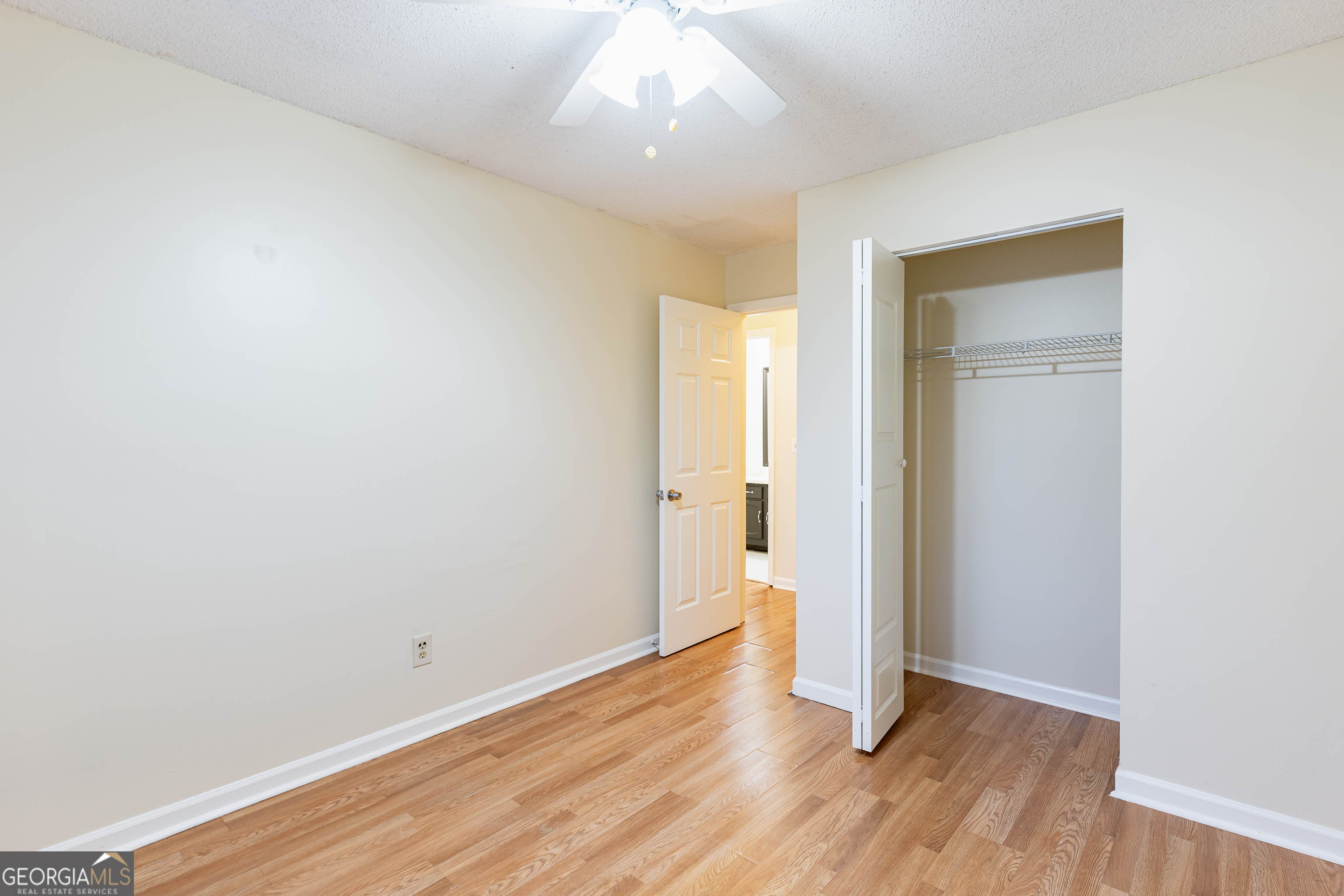 3821 Rex Mill Square Rex, GA 30273 - Photo 19 of 51 wooden floor in an empty room with a window