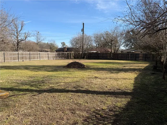 a view of a large swimming pool with an ocean view