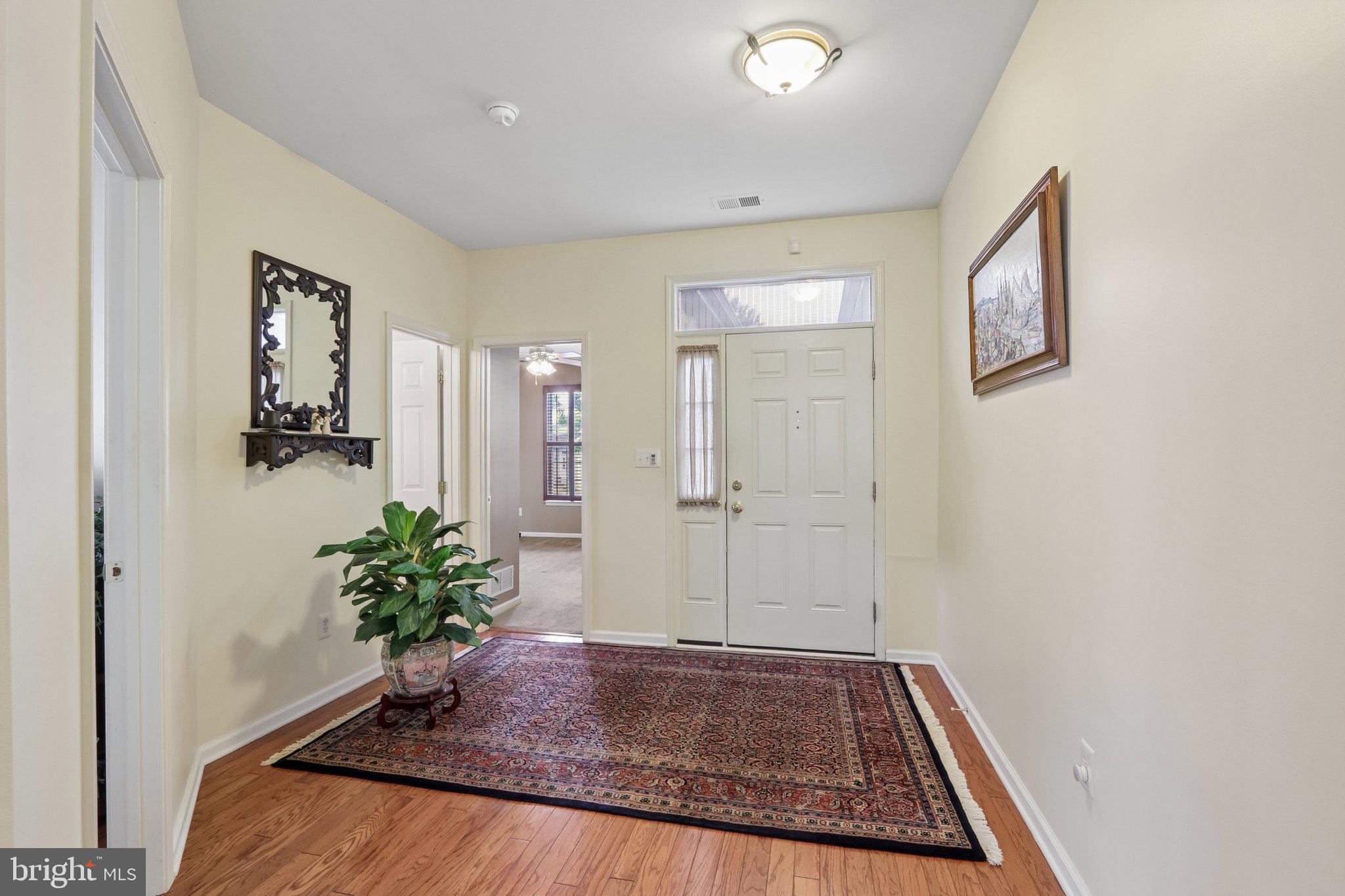 39 Danbury Road Swedesboro, NJ 08085 - Photo 3 of 62 a view of a hallway to a house with potted plant