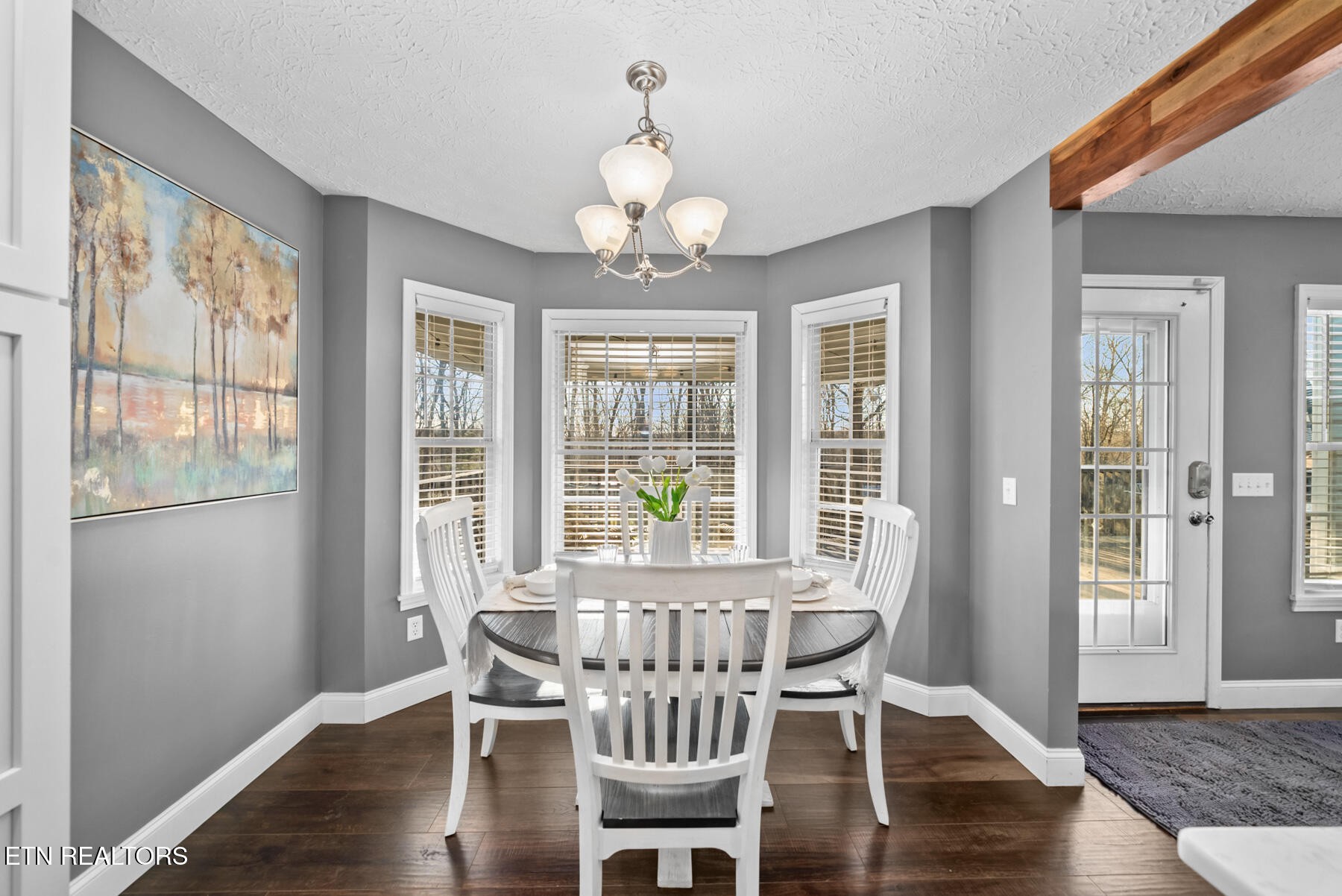 1378 Pow Camp Road Crossville, TN 38572 - Photo 15 of 59 a view of a dining room with furniture a chandelier and wooden floor