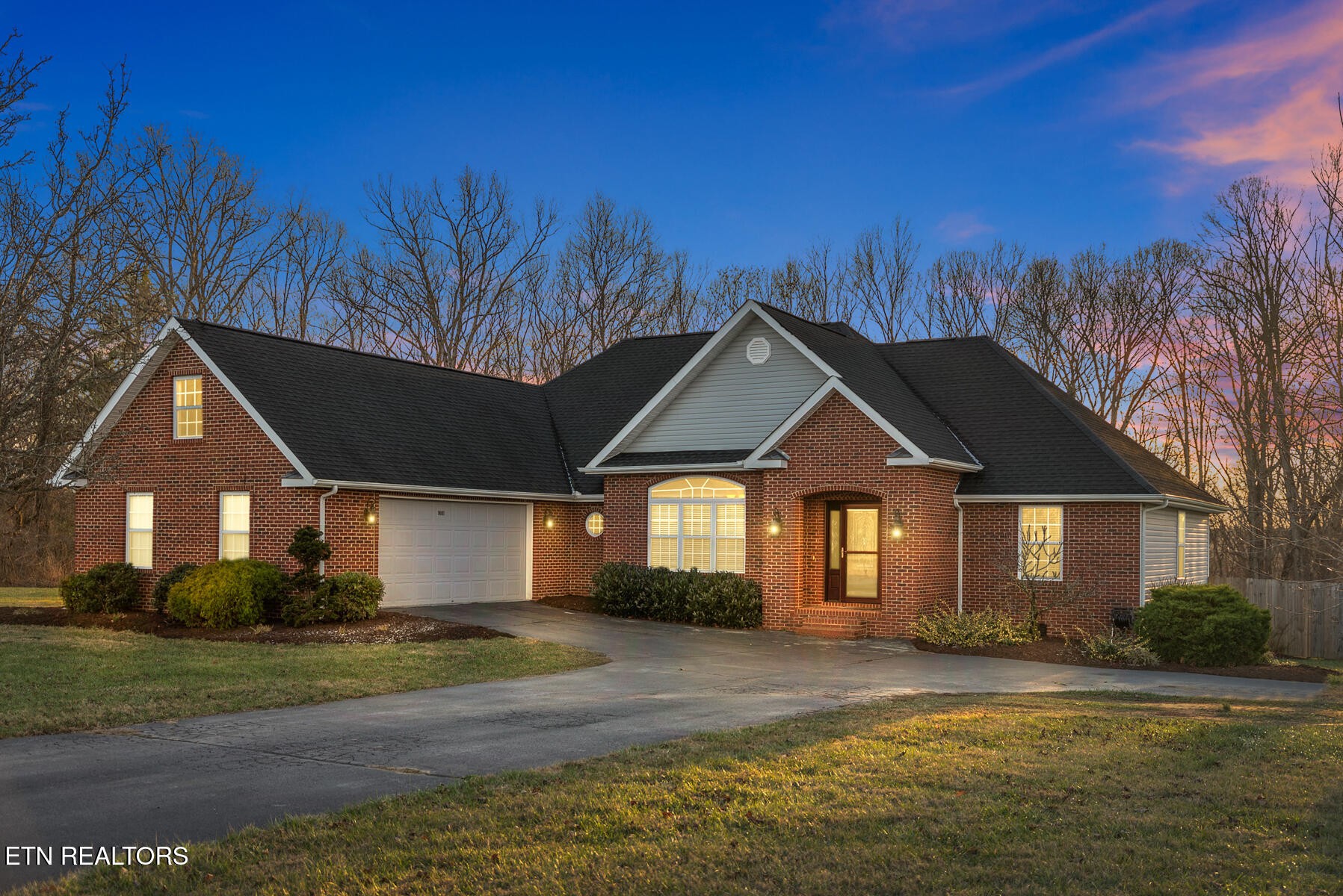 1378 Pow Camp Road Crossville, TN 38572 - Photo 2 of 59 a front view of a house with a yard and garage
