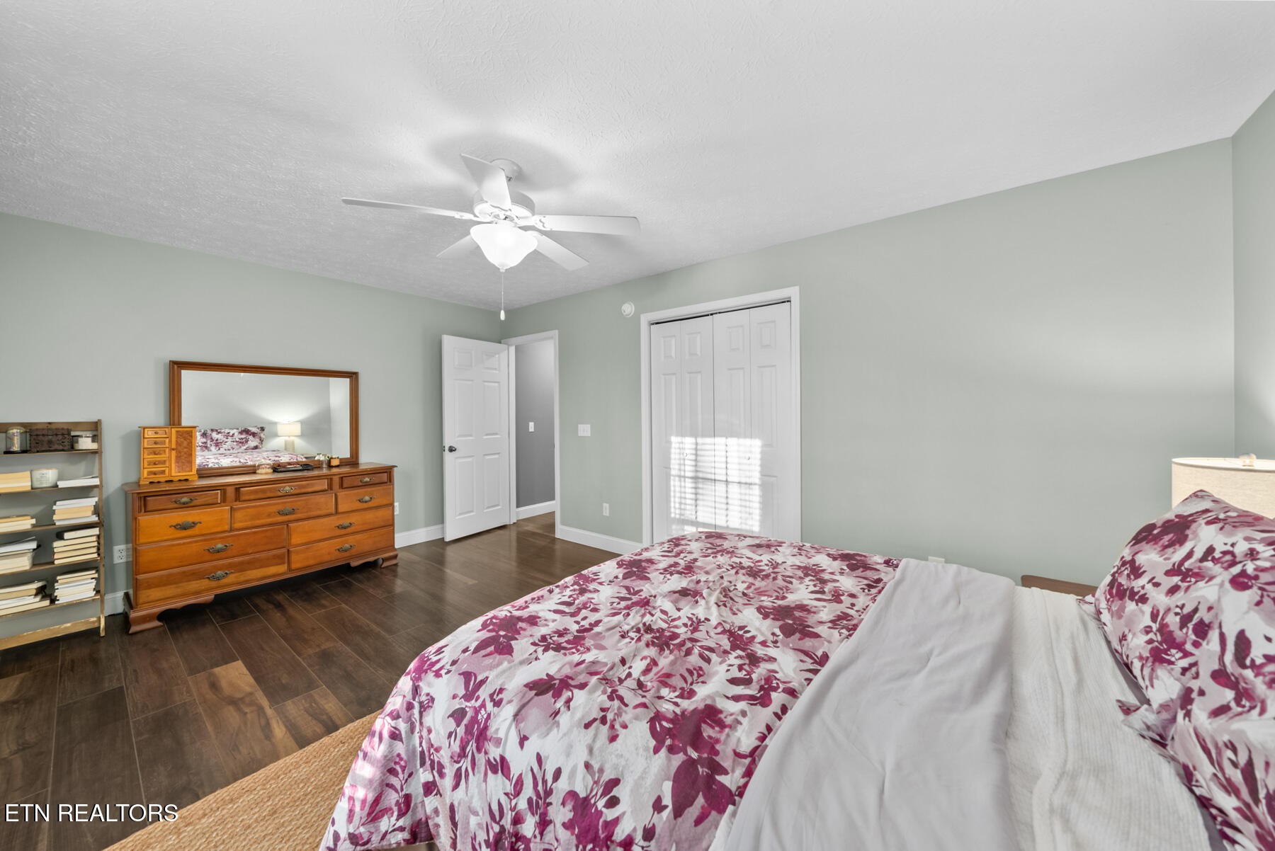 1378 Pow Camp Road Crossville, TN 38572 - Photo 28 of 59 a bedroom with a bed and a chandelier