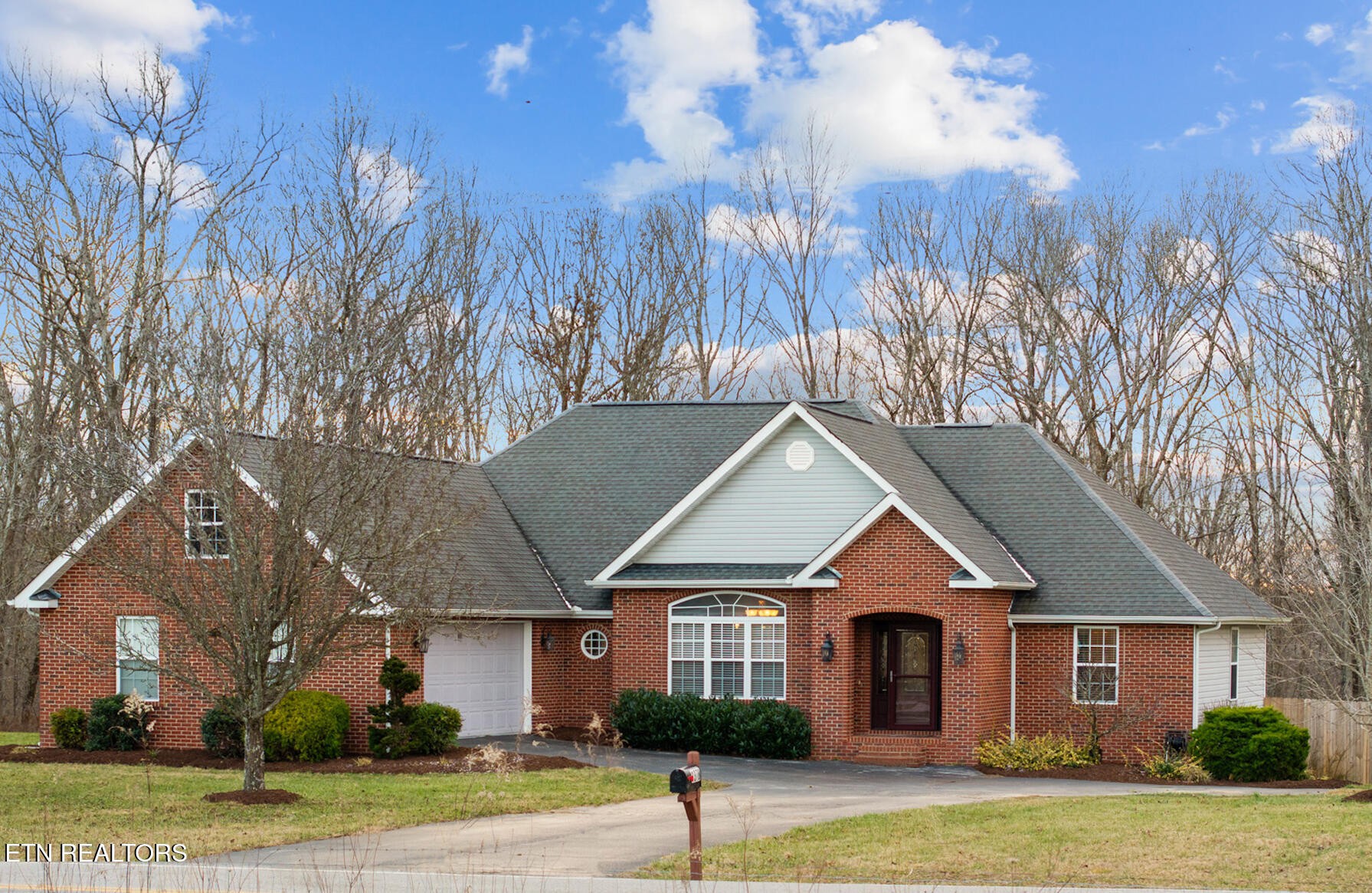 1378 Pow Camp Road Crossville, TN 38572 - Photo 3 of 59 a front view of a house with a yard