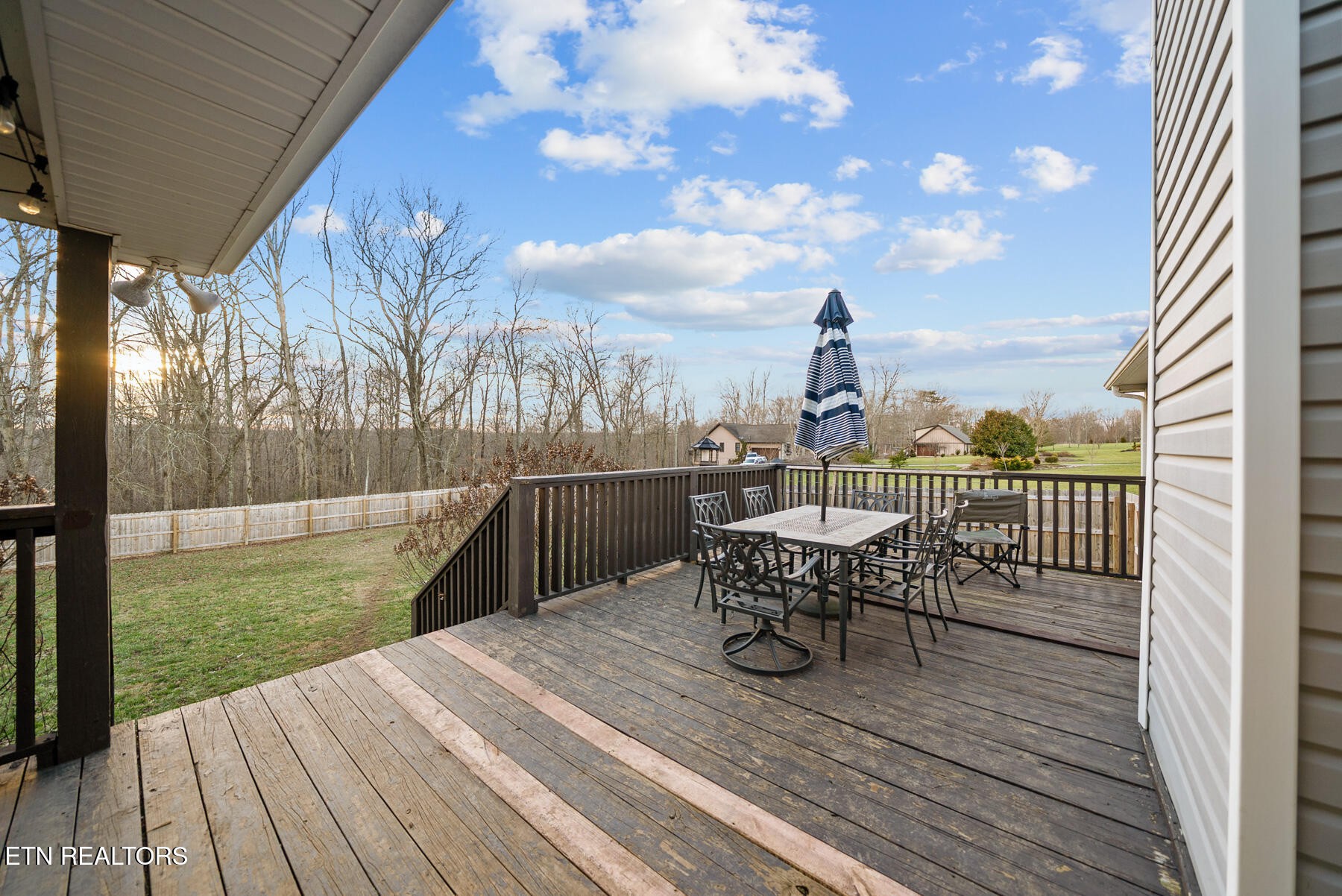 1378 Pow Camp Road Crossville, TN 38572 - Photo 35 of 59 a view of a deck with two chair and wooden floor