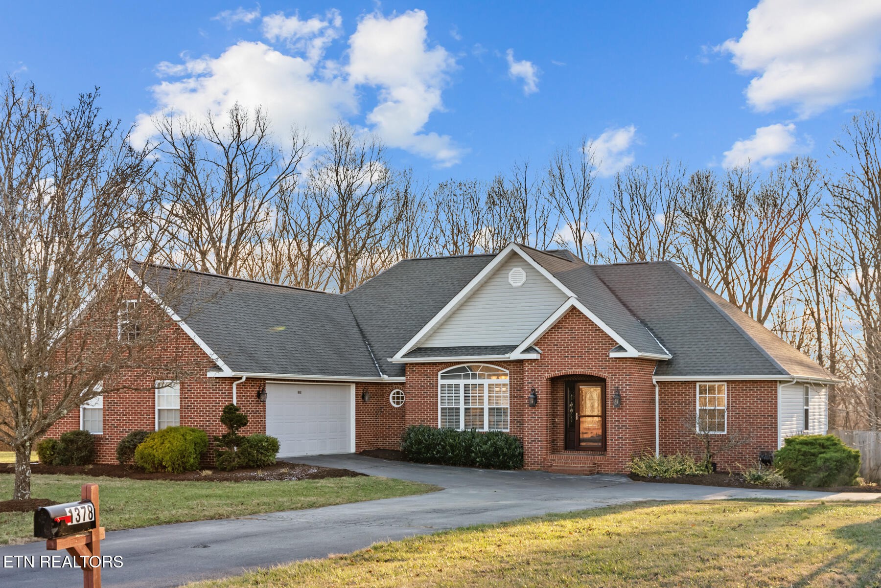 1378 Pow Camp Road Crossville, TN 38572 - Photo 49 of 59 a front view of a house with garden