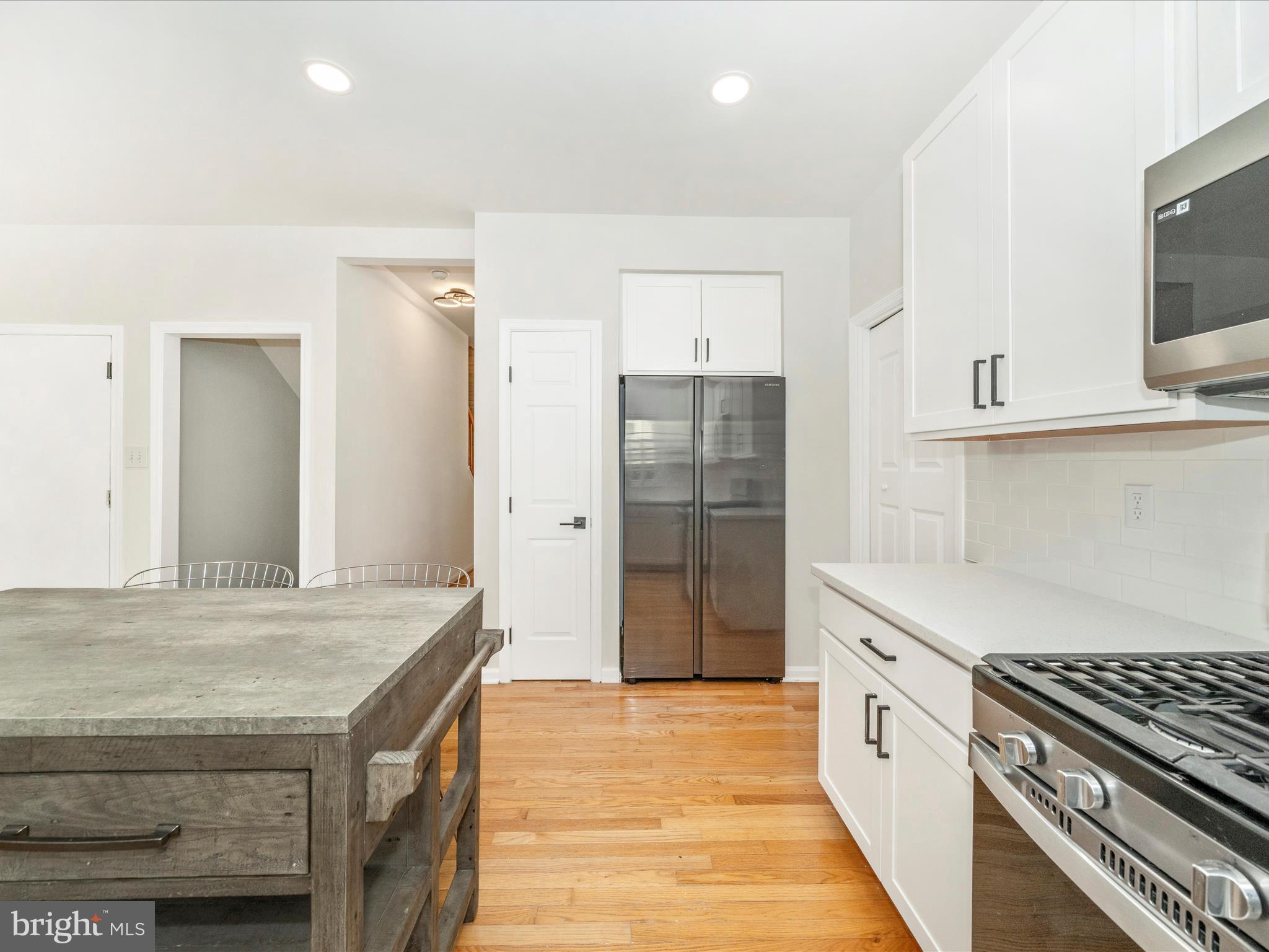 1764 Algonquin Road Frederick, MD 21701 - Photo 11 of 64 a kitchen with stainless steel appliances granite countertop a stove and a refrigerator