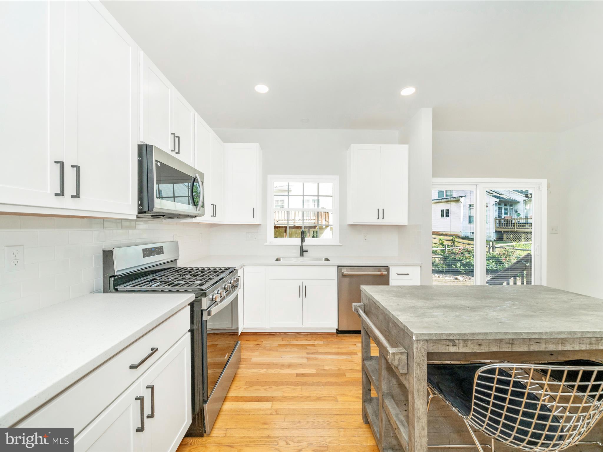 1764 Algonquin Road Frederick, MD 21701 - Photo 12 of 64 a kitchen with granite countertop a sink stove and cabinets