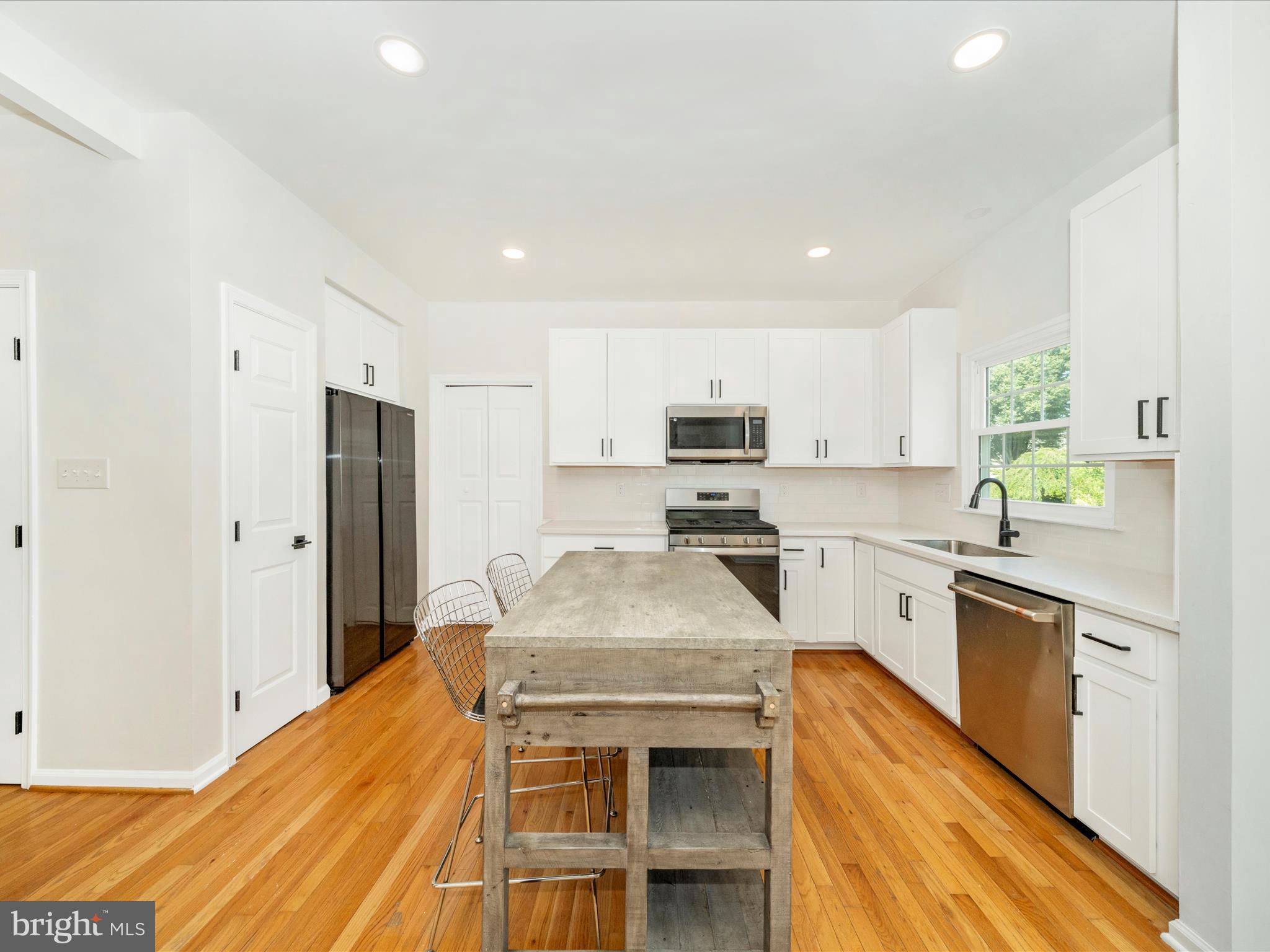 1764 Algonquin Road Frederick, MD 21701 - Photo 13 of 64 a kitchen with stainless steel appliances granite countertop a sink stove and refrigerator