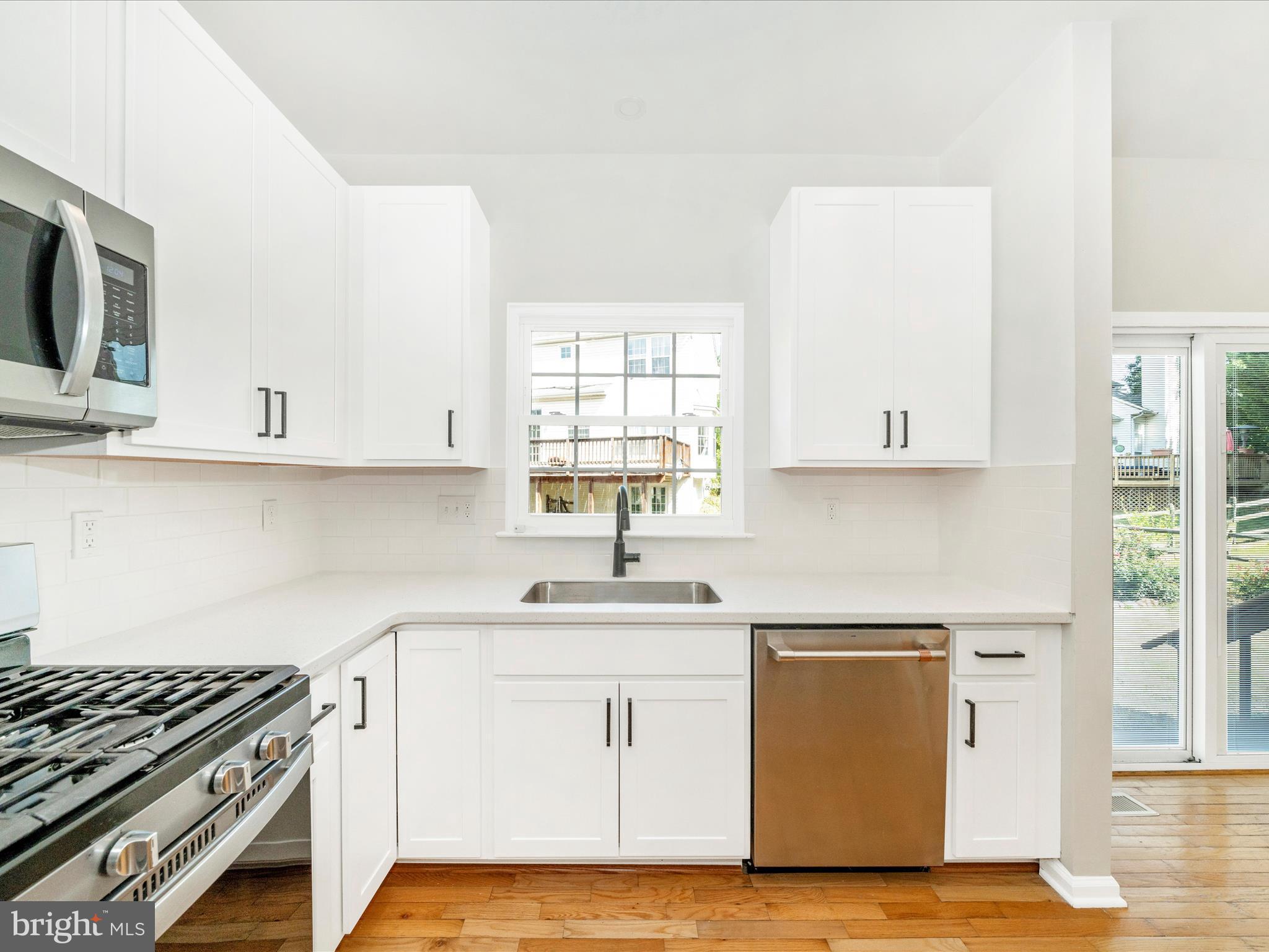 1764 Algonquin Road Frederick, MD 21701 - Photo 16 of 64 a kitchen with cabinets appliances a sink and a window