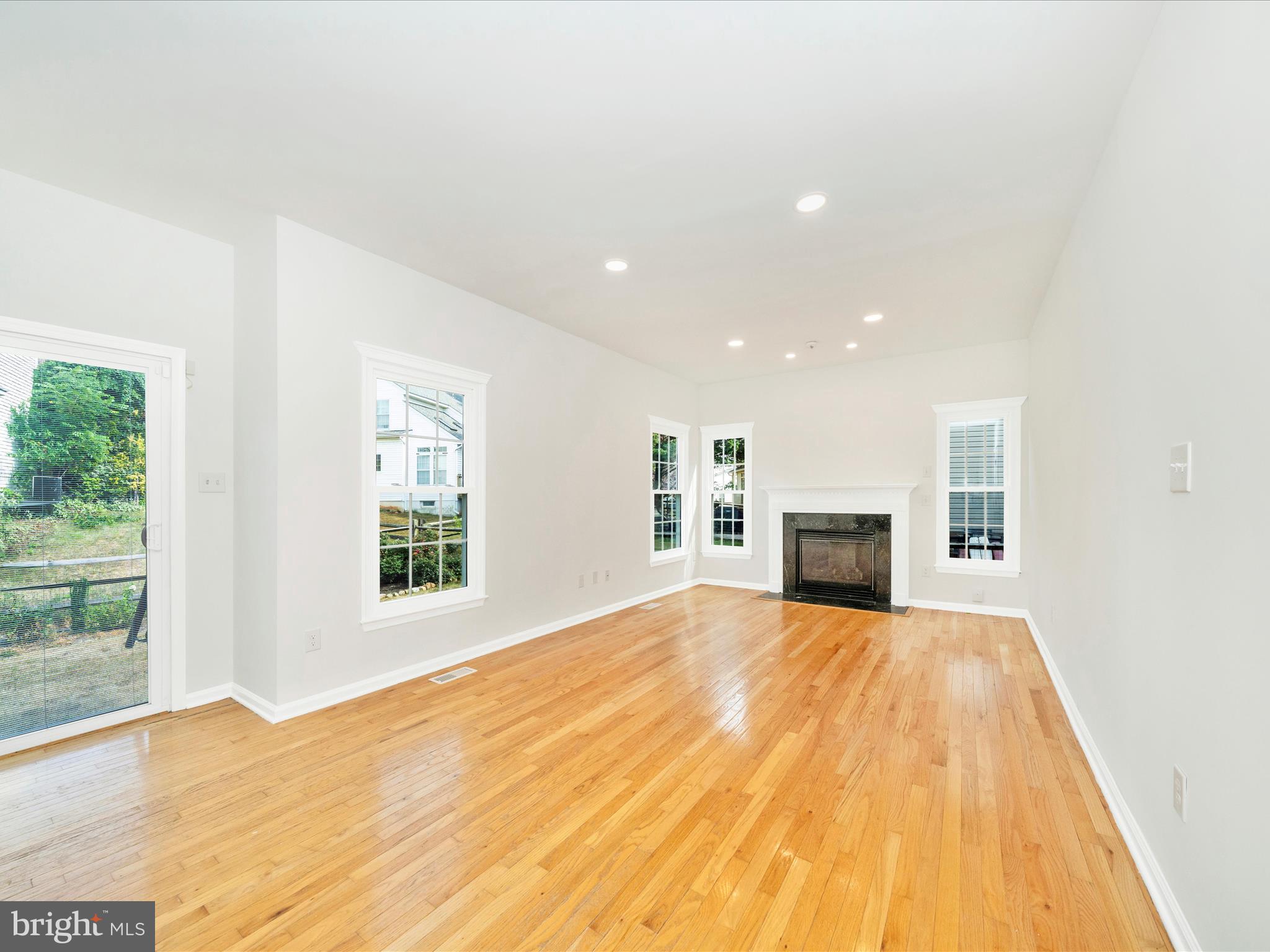 1764 Algonquin Road Frederick, MD 21701 - Photo 17 of 64 a view of empty room with wooden floor and fireplace