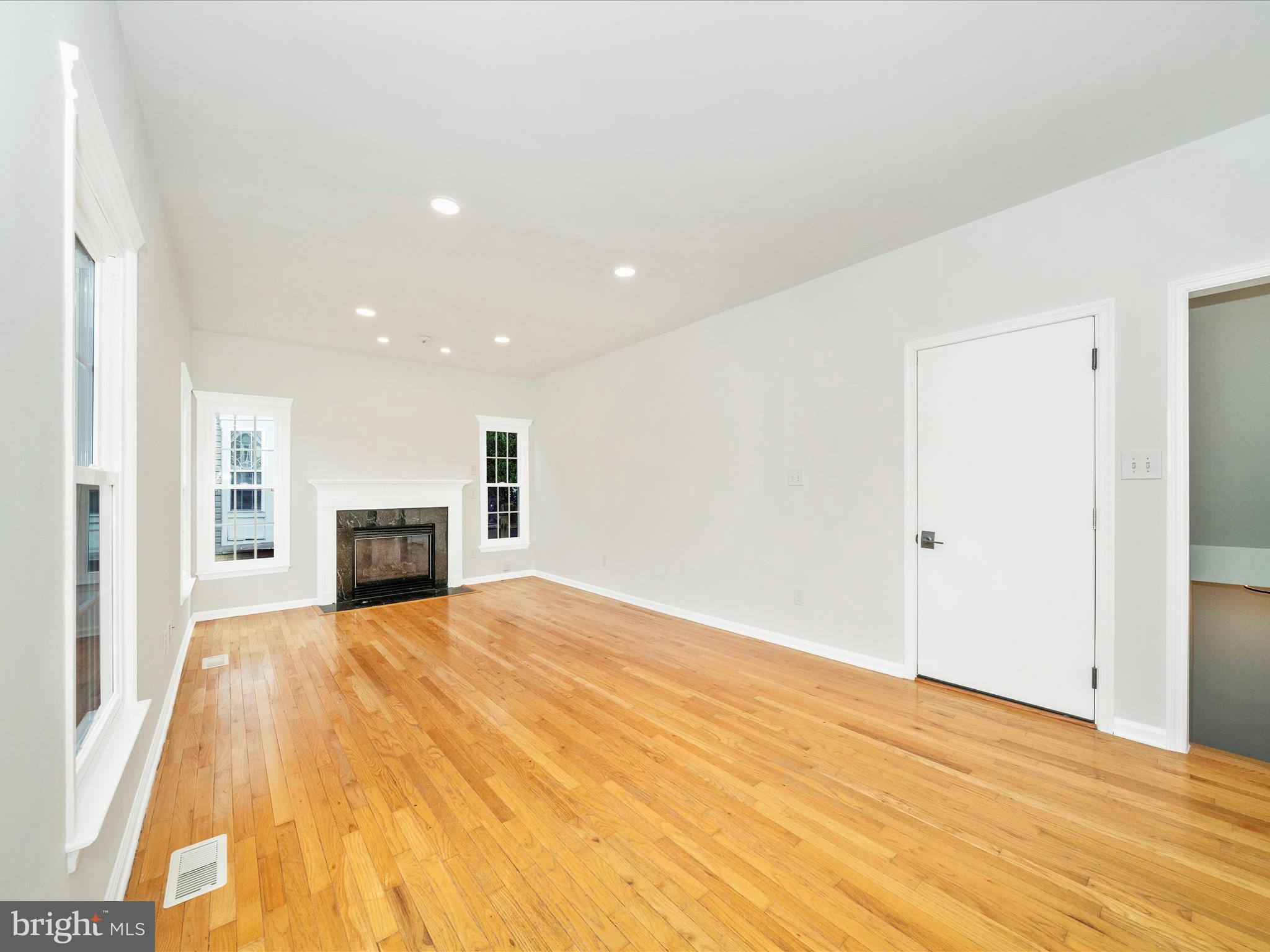 1764 Algonquin Road Frederick, MD 21701 - Photo 18 of 64 a view of empty room with wooden floor and fireplace