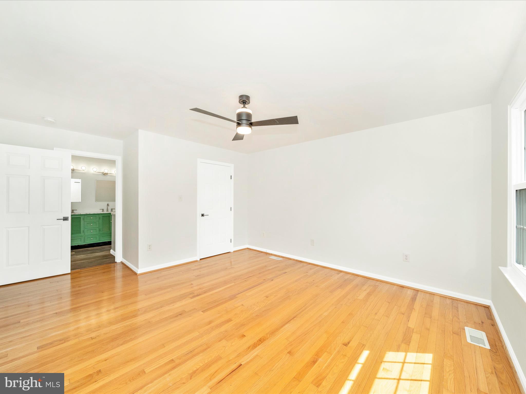 1764 Algonquin Road Frederick, MD 21701 - Photo 21 of 64 a view of a room with wooden floor and a ceiling fan