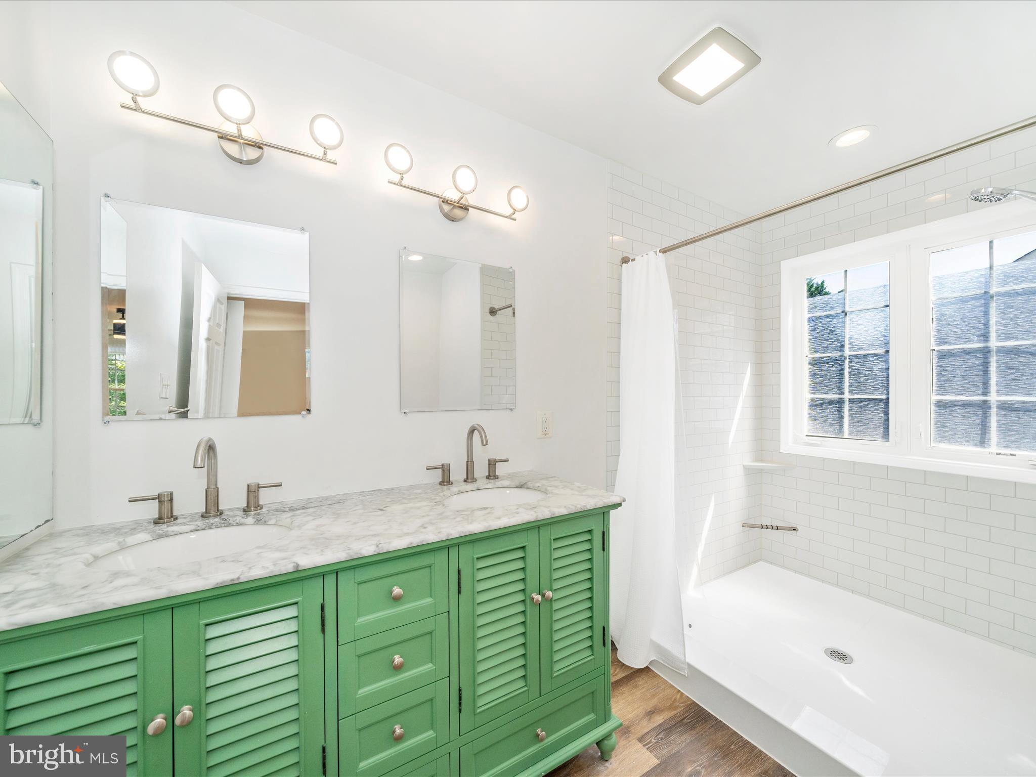 1764 Algonquin Road Frederick, MD 21701 - Photo 3 of 64 a bathroom with a tub sink and mirror