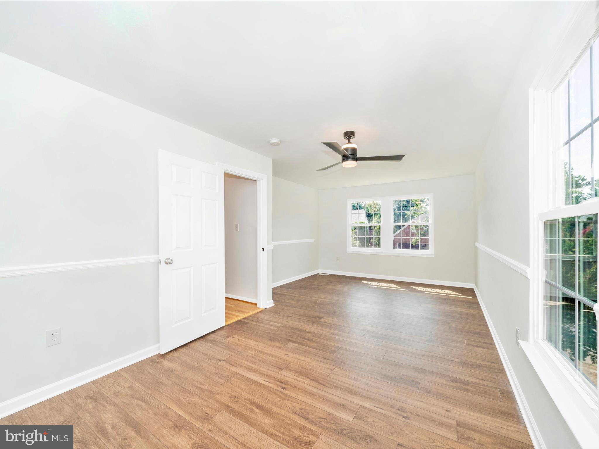 1764 Algonquin Road Frederick, MD 21701 - Photo 31 of 64 a view of an empty room with wooden floor and a window