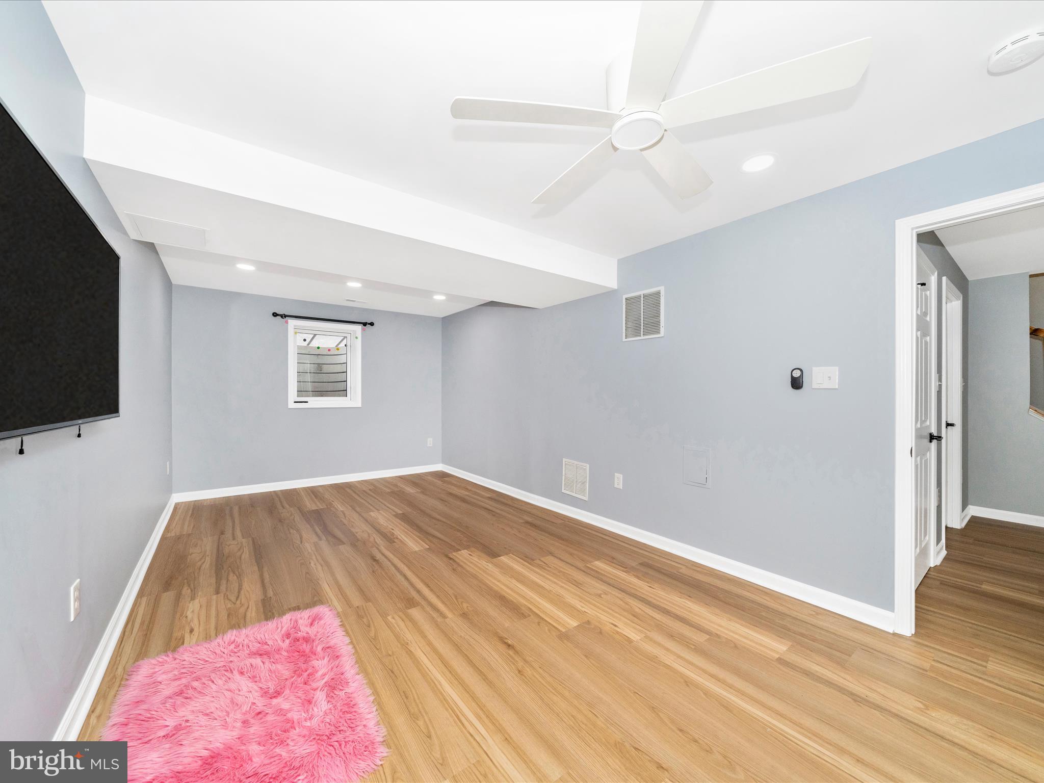 1764 Algonquin Road Frederick, MD 21701 - Photo 33 of 64 a view of a livingroom with wooden floor and a flat screen tv