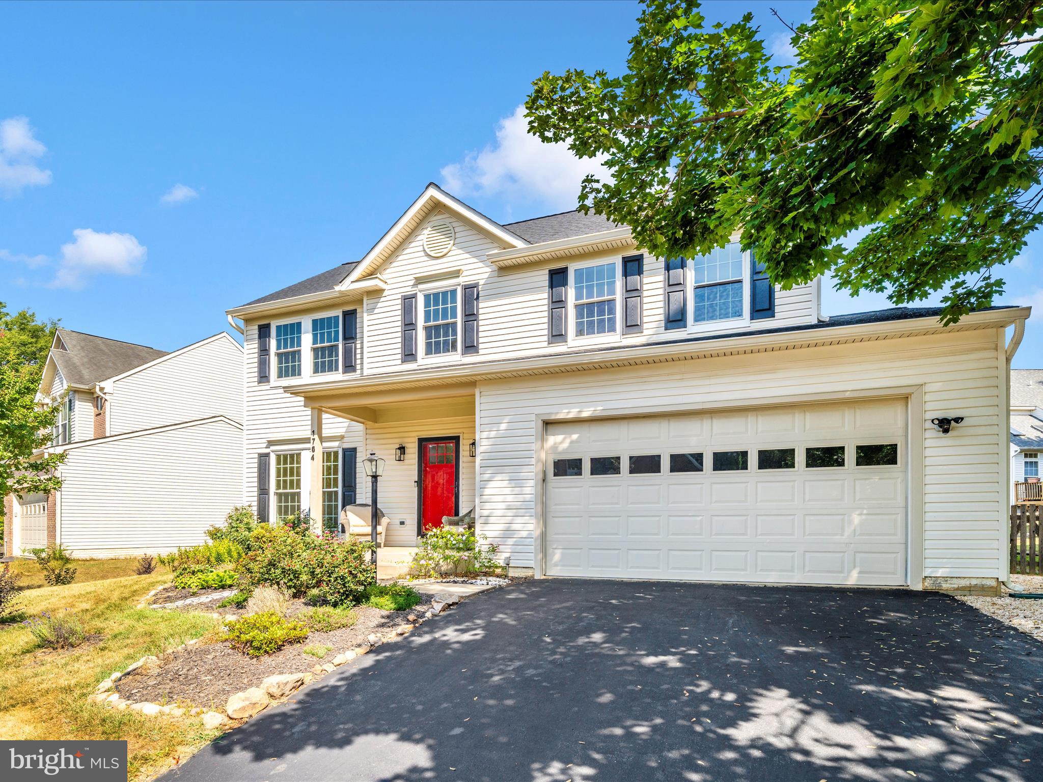 1764 Algonquin Road Frederick, MD 21701 - Photo 43 of 64 a front view of a house with a yard and garage