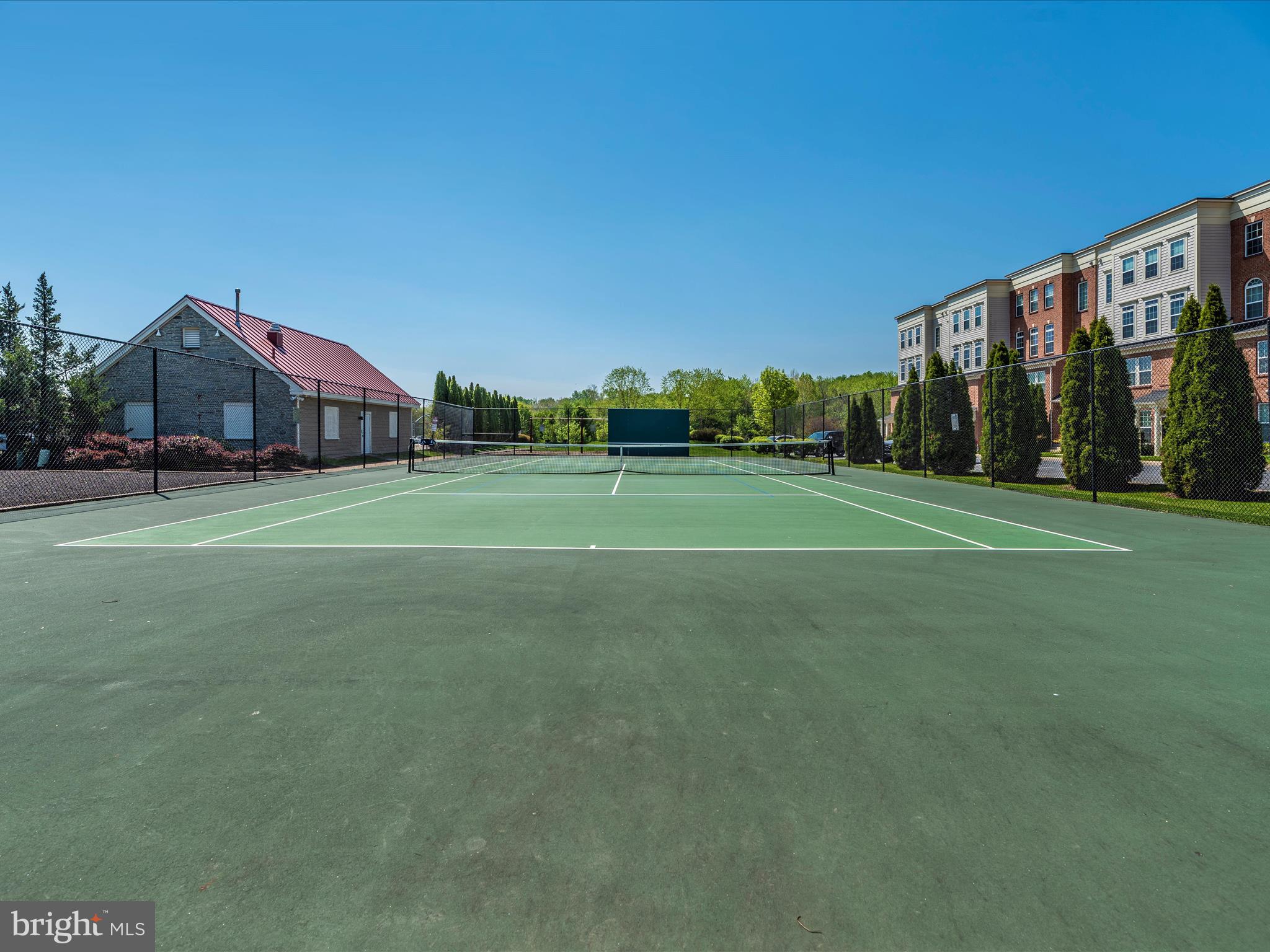 1764 Algonquin Road Frederick, MD 21701 - Photo 49 of 64 a view of a houses with a big yard and large trees