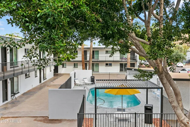 swimming pool view with a seating space