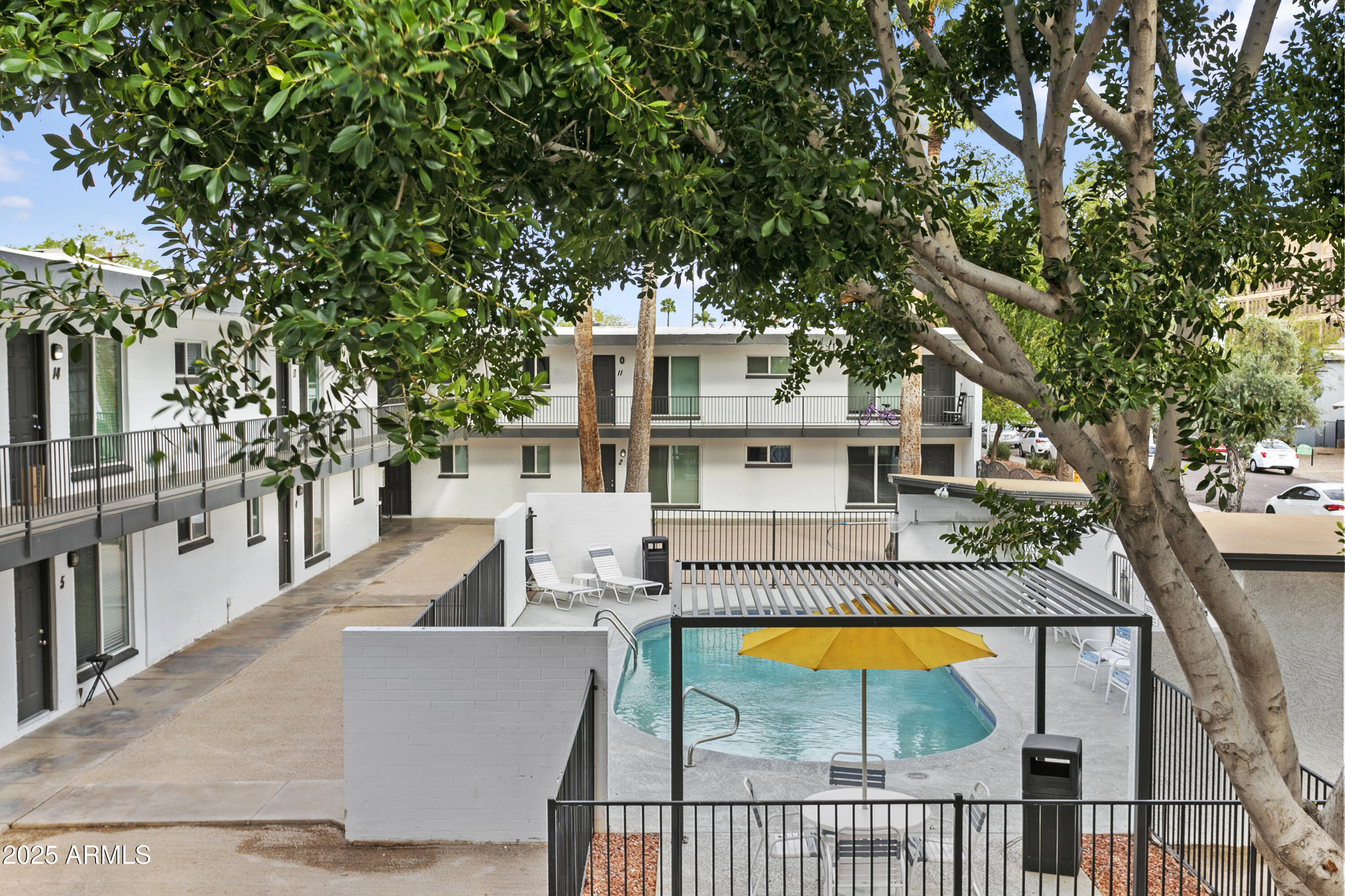 swimming pool view with a seating space