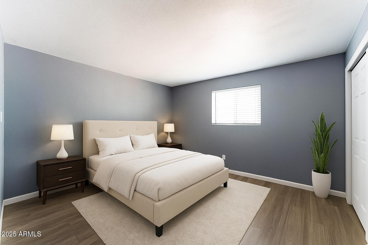 2014 West Berridge Lane Phoenix, AZ 85015 - Photo 13 of 23 a bedroom with a bed and a potted plant