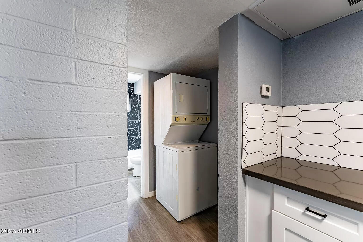 2014 West Berridge Lane Phoenix, AZ 85015 - Photo 18 of 23 a kitchen with a refrigerator and a stove